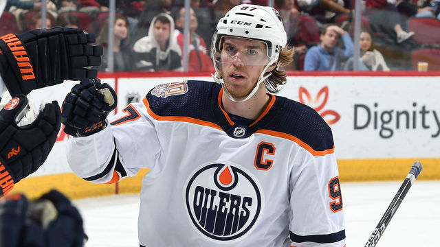 GLENDALE, AZ - JANUARY 02: Connor McDavid #97 of the Edmonton Oilers is congratulated by teammates after scoring a goal against the Arizona Coyotes during the second period at Gila River Arena on January 2, 2019 in Glendale, Arizona.