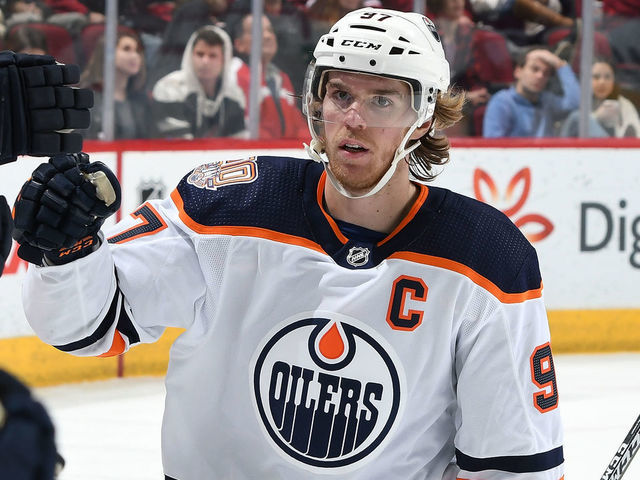 GLENDALE, AZ - JANUARY 02: Connor McDavid #97 of the Edmonton Oilers is congratulated by teammates after scoring a goal against the Arizona Coyotes during the second period at Gila River Arena on January 2, 2019 in Glendale, Arizona.