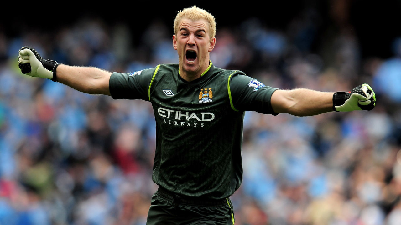 MANCHESTER, ENGLAND - MAY 13: Goalkeeper Joe Hart of Manchester City celebrates winning the title as the final whistle blows during the Barclays Premier League match between Manchester City and Queens Park Rangers at the Etihad Stadium on May 13, 2012 in Manchester, England.