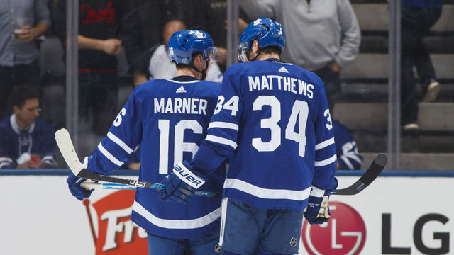 TORONTO, ON - DECEMBER 20: Auston Matthews #34 and Mitch Marner #16 of the Toronto Maple Leafs speak in a break against the Florida Panthers during the third period at the Scotiabank Arena on December 20, 2018 in Toronto, Ontario, Canada.