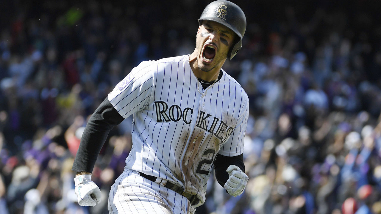 DENVER, CO - SEPTEMBER 30: Colorado Rockies third baseman Nolan Arenado (28) reacts after hitting a two-run home run against Washington Nationals relief pitcher Erick Fedde (23) in the first inning at Coors Field September 30, 2018.