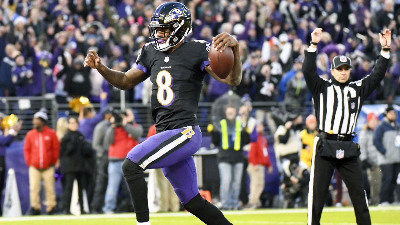 BALTIMORE, MD - DECEMBER 30: Baltimore Ravens quarterback Lamar Jackson (8) runs for a touchdown in the first quarter against the Cleveland Browns on December 30, 2018, at M&T Bank Stadium in Baltimore, MD.