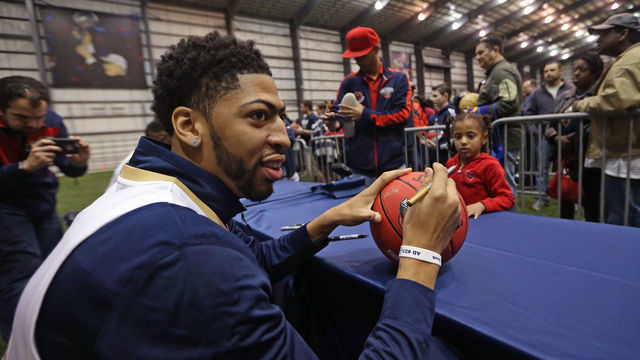 NEW ORLEANS, LA - JANUARY 28: Anthony Davis #23 of the New Orleans Pelicans signs autographs for fans as the Pelicans hold their annual season tickets sales event on January 28, 2017 at New Orleans Saints/Pelicans Practice Facility in New Orleans, Louisiana. Mandatory Copyright Notice: Copyright 2017 NBAE