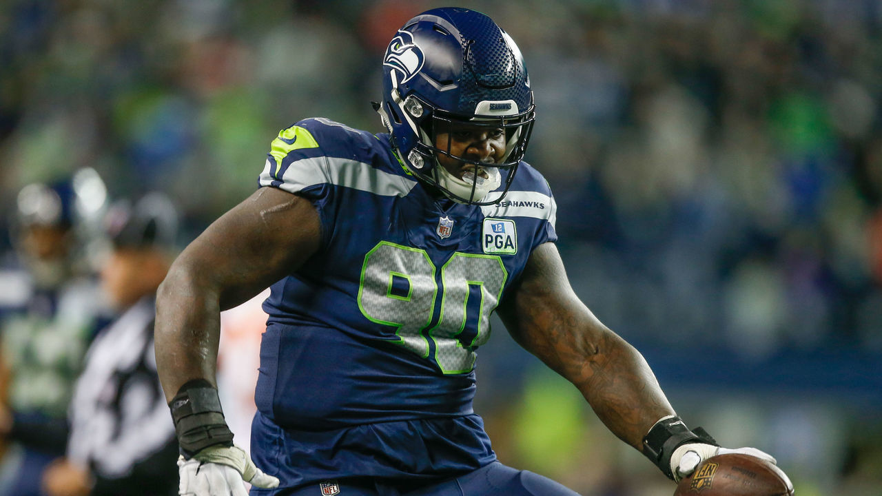 SEATTLE, WA - DECEMBER 23: Defensive tackle Jarran Reed #90 of the Seattle Seahawks reacts after recovering a fumble against the Kansas City Chiefs at CenturyLink Field on December 23, 2018 in Seattle, Washington.