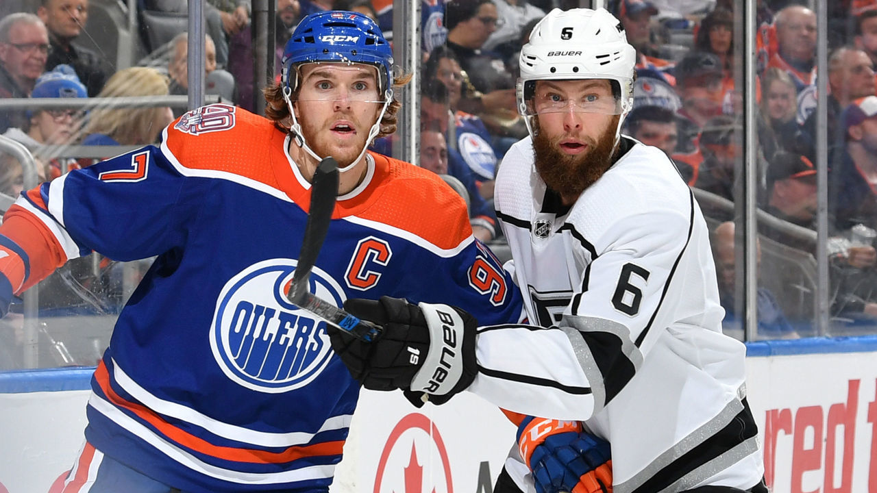 EDMONTON, AB - NOVEMBER 29: Connor McDavid #97 of the Edmonton Oilers battles for the puck against Jake Muzzin #6 of the Los Angeles Kings on November 29, 2018 at Rogers Place in Edmonton, Alberta, Canada.