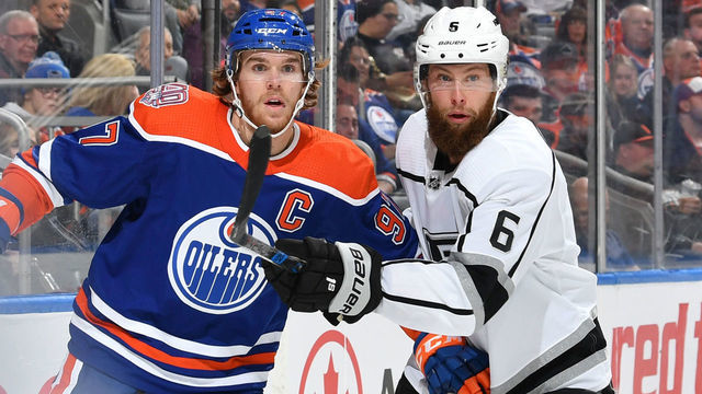 EDMONTON, AB - NOVEMBER 29: Connor McDavid #97 of the Edmonton Oilers battles for the puck against Jake Muzzin #6 of the Los Angeles Kings on November 29, 2018 at Rogers Place in Edmonton, Alberta, Canada.
