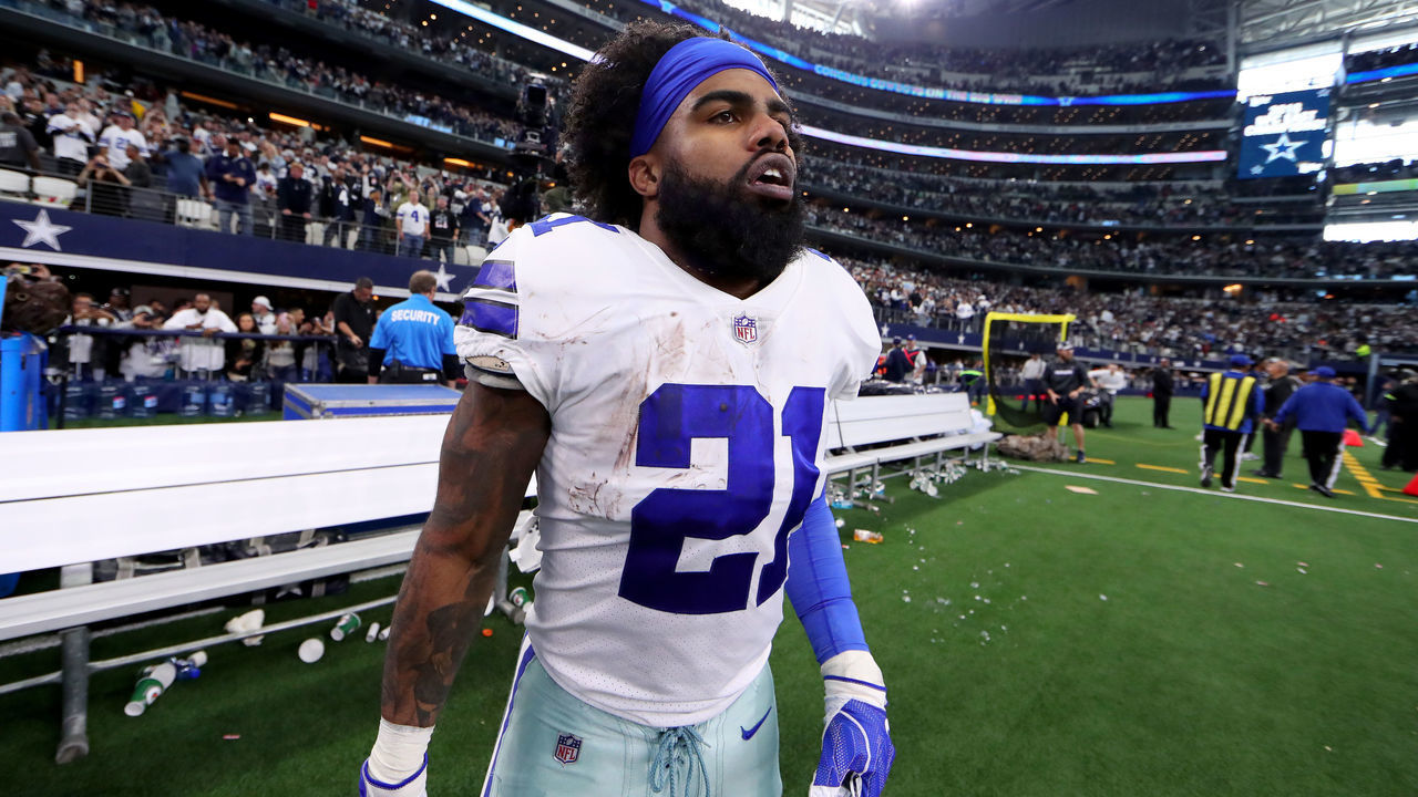ARLINGTON, TEXAS - DECEMBER 23: Ezekiel Elliott #21 of the Dallas Cowboys walks off the field after the Dallas Cowboys beat the Tampa Bay Buccaneers 27-20 at AT&T Stadium on December 23, 2018 in Arlington, Texas.