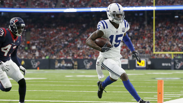 HOUSTON, TX - JANUARY 05: Dontrelle Inman #15 of the Indianapolis Colts catches a pass for a touchdown defended by Shareece Wright #43 of the Houston Texans in the second quarter during the Wild Card Round at NRG Stadium on January 5, 2019 in Houston, Texas.