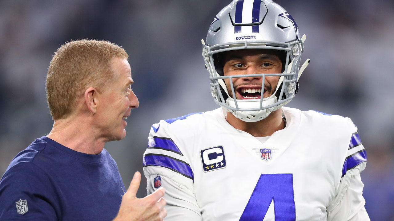 ARLINGTON, TEXAS - JANUARY 05: Head coach Jason Garrett visits with Dak Prescott #4 of the Dallas Cowboys before the game against the Seattle Seahawks during the Wild Card Round at AT&T Stadium on January 05, 2019 in Arlington, Texas.