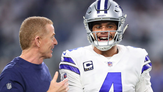 ARLINGTON, TEXAS - JANUARY 05: Head coach Jason Garrett visits with Dak Prescott #4 of the Dallas Cowboys before the game against the Seattle Seahawks during the Wild Card Round at AT&T Stadium on January 05, 2019 in Arlington, Texas.