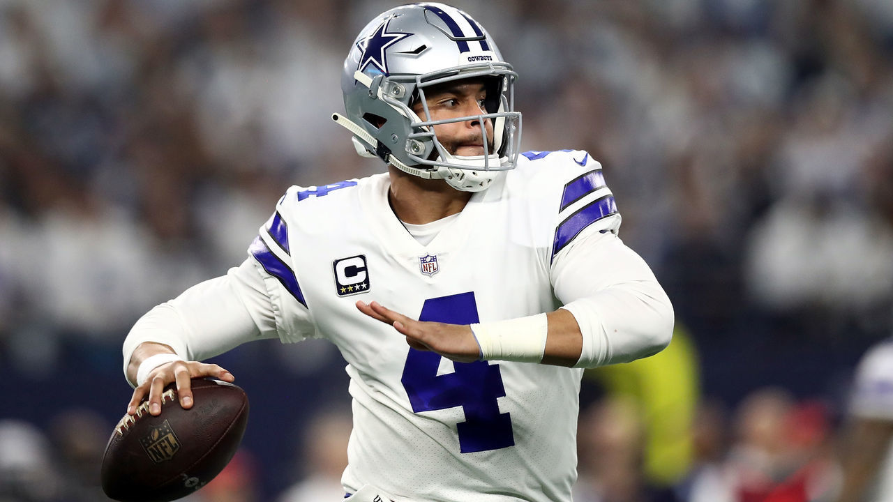 ARLINGTON, TEXAS - JANUARY 05: Dak Prescott #4 of the Dallas Cowboys looks to pass against the Seattle Seahawks in the first quarter during the Wild Card Round at AT&T Stadium on January 05, 2019 in Arlington, Texas.