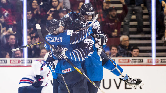 VANCOUVER, BC - JANUARY 5: Oskari Laaksonen #2, Valtteri Puustinen #13 and Anton Lundell #29 of Finland celebrates with goal scorer Jesse Ylonen #27 of Finland (not pictured) taking a 1-0 lead over the United States in Gold Medal hockey action of the 2019 IIHF World Junior Championship on January, 5, 2019 at Rogers Arena in Vancouver, British Columbia, Canada.