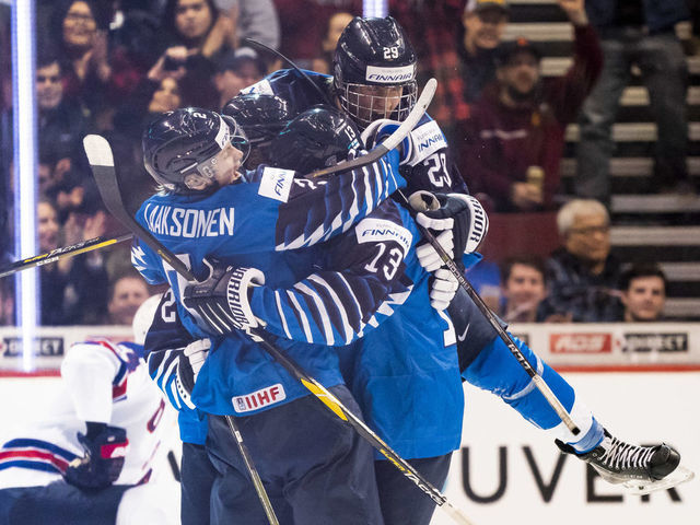 VANCOUVER, BC - JANUARY 5: Oskari Laaksonen #2, Valtteri Puustinen #13 and Anton Lundell #29 of Finland celebrates with goal scorer Jesse Ylonen #27 of Finland (not pictured) taking a 1-0 lead over the United States in Gold Medal hockey action of the 2019 IIHF World Junior Championship on January, 5, 2019 at Rogers Arena in Vancouver, British Columbia, Canada.