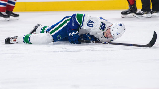 MONTREAL, QC - JANUARY 03: Vancouver Canucks center Elias Pettersson (40) lays on the ice in pain during the second period of the NHL game between the Vancouver Canucks and the Montreal Canadiens on January 03, 2019, at the Bell Centre in Montreal, QC