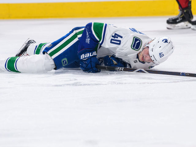 MONTREAL, QC - JANUARY 03: Vancouver Canucks center Elias Pettersson (40) lays on the ice in pain during the second period of the NHL game between the Vancouver Canucks and the Montreal Canadiens on January 03, 2019, at the Bell Centre in Montreal, QC