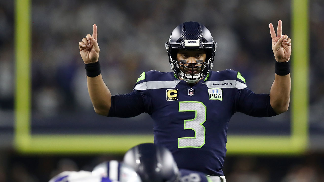 ARLINGTON, TEXAS - JANUARY 05: Russell Wilson #3 of the Seattle Seahawks gestures before a play in the third quarter against the Dallas Cowboys during the Wild Card Round at AT&T Stadium on January 05, 2019 in Arlington, Texas.