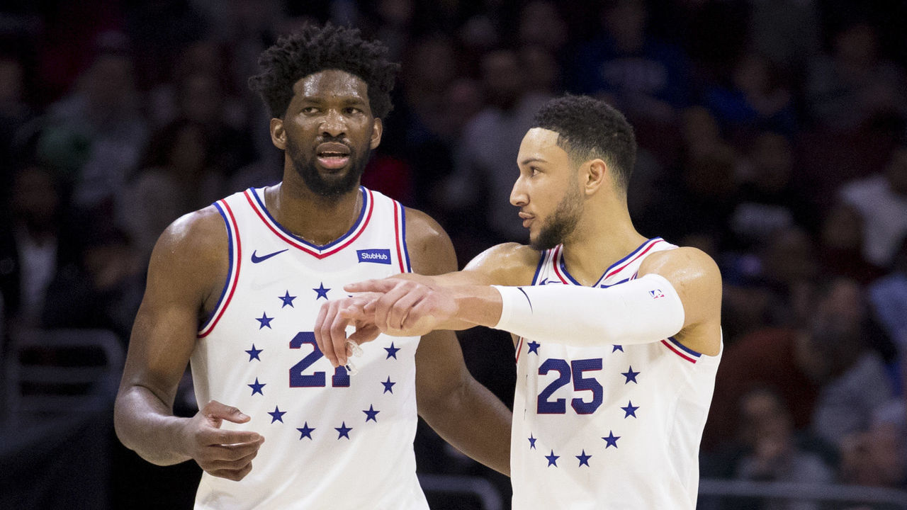 PHILADELPHIA, PA - JANUARY 05: Joel Embiid #21 of the Philadelphia 76ers talks to Ben Simmons #25 in the fourth quarter against the Dallas Mavericks at Wells Fargo Center on January 5, 2019 in Philadelphia, Pennsylvania. The 76ers defeated the Mavericks 106-100.