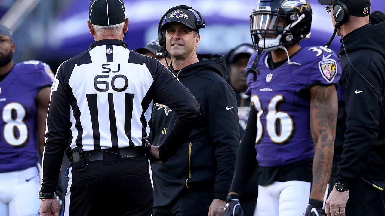 BALTIMORE, MARYLAND - JANUARY 06: Head coach John Harbaugh of the Baltimore Ravens argues a call with Side Judge Gary Cavaletto #60 against the Los Angeles Chargers during the fourth quarter in the AFC Wild Card Playoff game at M&T Bank Stadium on January 06, 2019 in Baltimore, Maryland.