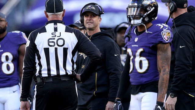 BALTIMORE, MARYLAND - JANUARY 06: Head coach John Harbaugh of the Baltimore Ravens argues a call with Side Judge Gary Cavaletto #60 against the Los Angeles Chargers during the fourth quarter in the AFC Wild Card Playoff game at M&T Bank Stadium on January 06, 2019 in Baltimore, Maryland.