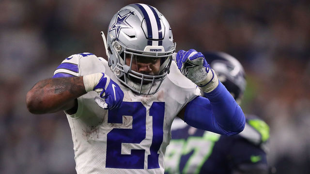 ARLINGTON, TEXAS - JANUARY 05: Ezekiel Elliott #21 of the Dallas Cowboys does the 'feed me' gesture after a first down in the fourth quarter against the Seattle Seahawks during the Wild Card Round at AT&T Stadium on January 05, 2019 in Arlington, Texas.
