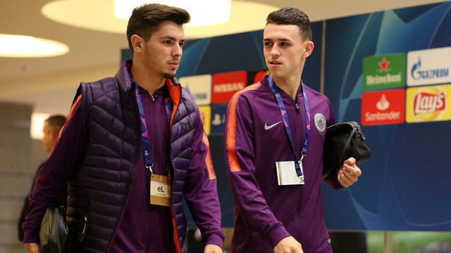 KHARKOV, UKRAINE - OCTOBER 23: Brahim Diaz of Manchester City and Phil Foden of Manchester City speak as they arrive at the stadium prior to the Group F match of the UEFA Champions League between FC Shakhtar Donetsk and Manchester City at Metalist Stadium on October 23, 2018 in Kharkov, Ukraine.