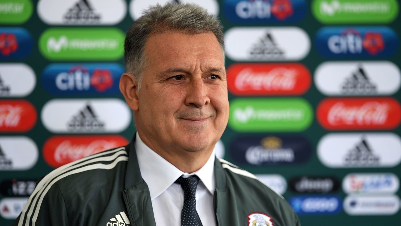 Argentine coach Gerardo 'Tata' Martino poses with a training jacket of the Mexican national football team during his presentation as new coach of the squad, at the High Performance Centre (CAR) on the outskirts of Mexico City on January 7, 2019.