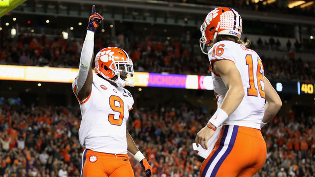 SANTA CLARA, CA - JANUARY 07: Travis Etienne #9 of the Clemson Tigers celebrates his second quarter touchdown with Trevor Lawrence #16 against thw Alabama Crimson Tide in the CFP National Championship presented by AT&T at Levi's Stadium on January 7, 2019 in Santa Clara, California.