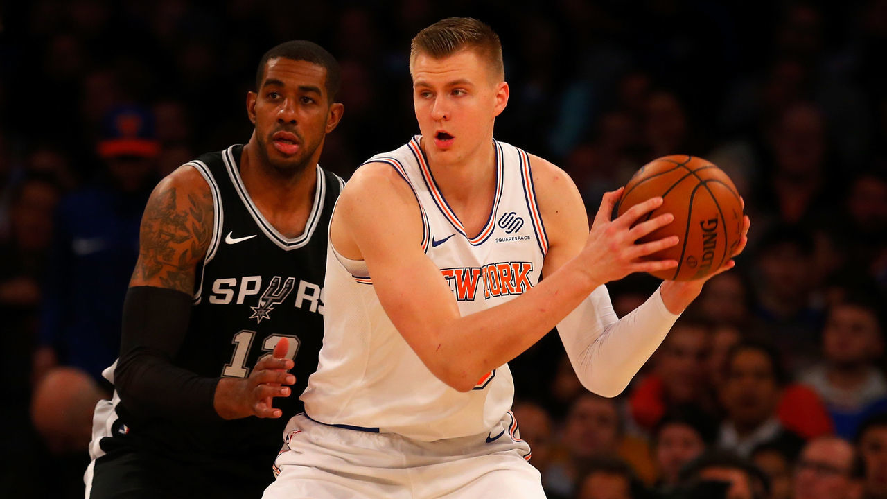 NEW YORK, NY - JANUARY 02: (NEW YORK DAILIES OUT) LaMarcus Aldridge #12 of the San Antonio Spurs in action against Kristaps Porzingis #6 of the New York Knicks at Madison Square Garden on January 2, 2018 in New York City. The Spurs defeated the Knicks 100-91. NOTE TO USER: User expressly acknowledges and agrees that, by downloading and/or using this Photograph, user is consenting to the terms and conditions of the Getty Images License Agreement.
