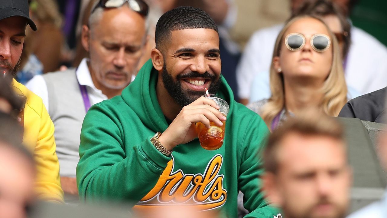 Rapper Drake sits on Centre Court before US player Serena Williams plays against Italy's Camila Giorgi during their women's singles quarter-final match on the eighth day of the 2018 Wimbledon Championships at The All England Lawn Tennis Club in Wimbledon, southwest London, on July 10, 2018.