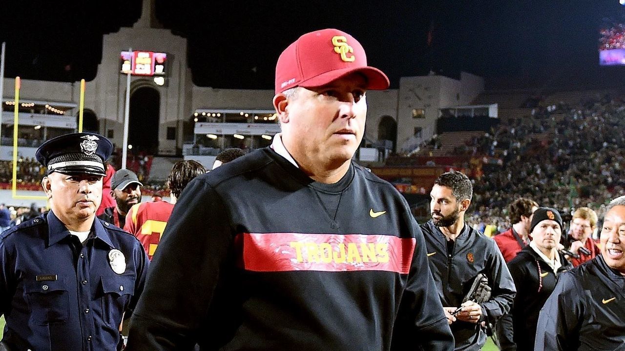 LOS ANGELES, CA- NOVEMBER 24: Head coach Clay Helton of the USC Trojans walks off the field as Notre Dame Fighting Irish defeated USC Trojans 24-17 during a NCAA football game at the Los Angeles Memorial Coliseum on Saturday, November 24, 2018 in Los Angeles, California.