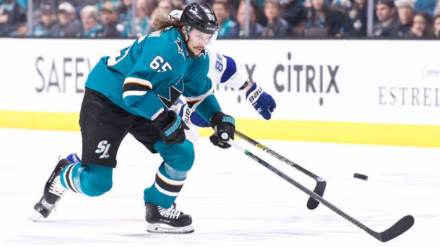 SAN JOSE, CA - JANUARY 05: San Jose Sharks defenseman Erik Karlsson (65) races to a loose puck during the San Jose Sharks game versus the Tampa Bay Lightning on January 5, 2019, at SAP Center in San Jose, CA