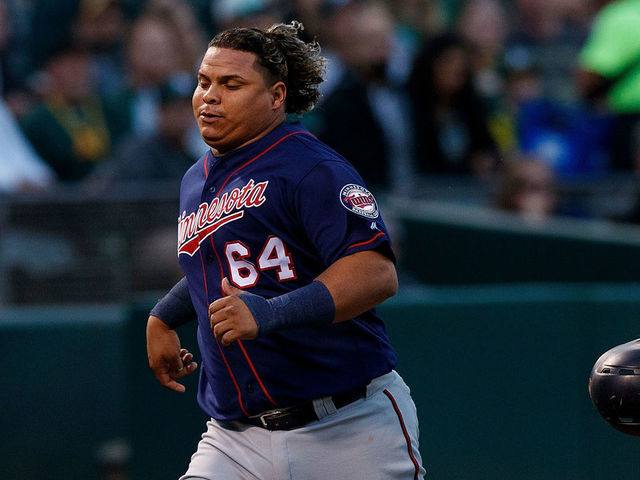 OAKLAND, CA - SEPTEMBER 22: Willians Astudillo #64 of the Minnesota Twins scores a run against the Oakland Athletics during the third inning at the Oakland Coliseum on September 22, 2018 in Oakland, California. The Oakland Athletics defeated the Minnesota Twins 3-2.