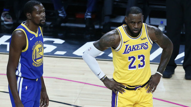 LAS VEGAS, NV- OCTOBER 10: LeBron James #23 of the Los Angeles Lakers and Kevin Durant #35 of the Golden State Warriors look on during the game on October 10, 2018 at T-Mobile Arena in Las Vegas, Nevada. NOTE TO USER: User expressly acknowledges and agrees that, by downloading and/or using this Photograph, user is consenting to the terms and conditions of the Getty Images License Agreement. Mandatory Copyright Notice: Copyright 2018 NBAE