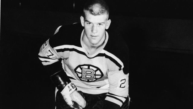 Portrait of Canadian professional ice hockey player defenseman Bobby Orr of the Boston Bruins at the ready on the ice with stick, skates, and gloves, 1966. Orr played with the Bruins from 1966 to 1976 and then for the Chicago Blackhawks until 1979. This photo is probably from his first few days with the Bruins as he is wearing jersey #27 and gloves #37 yet went on to play as #4.