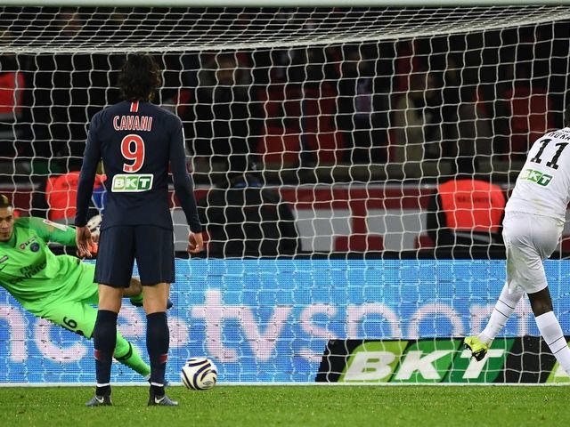 Guingamp's French forward Marcus Thuram (R) shoots and scores a penaty kick past Paris Saint-Germain's French goalkeeper Alphonse Areola (L) during the French League Cup quarter-final football match between Paris Saint-Germain (PSG) and Guingamp (EAG) on January 9, 2019, at the Parc des Princes stadium in Paris.