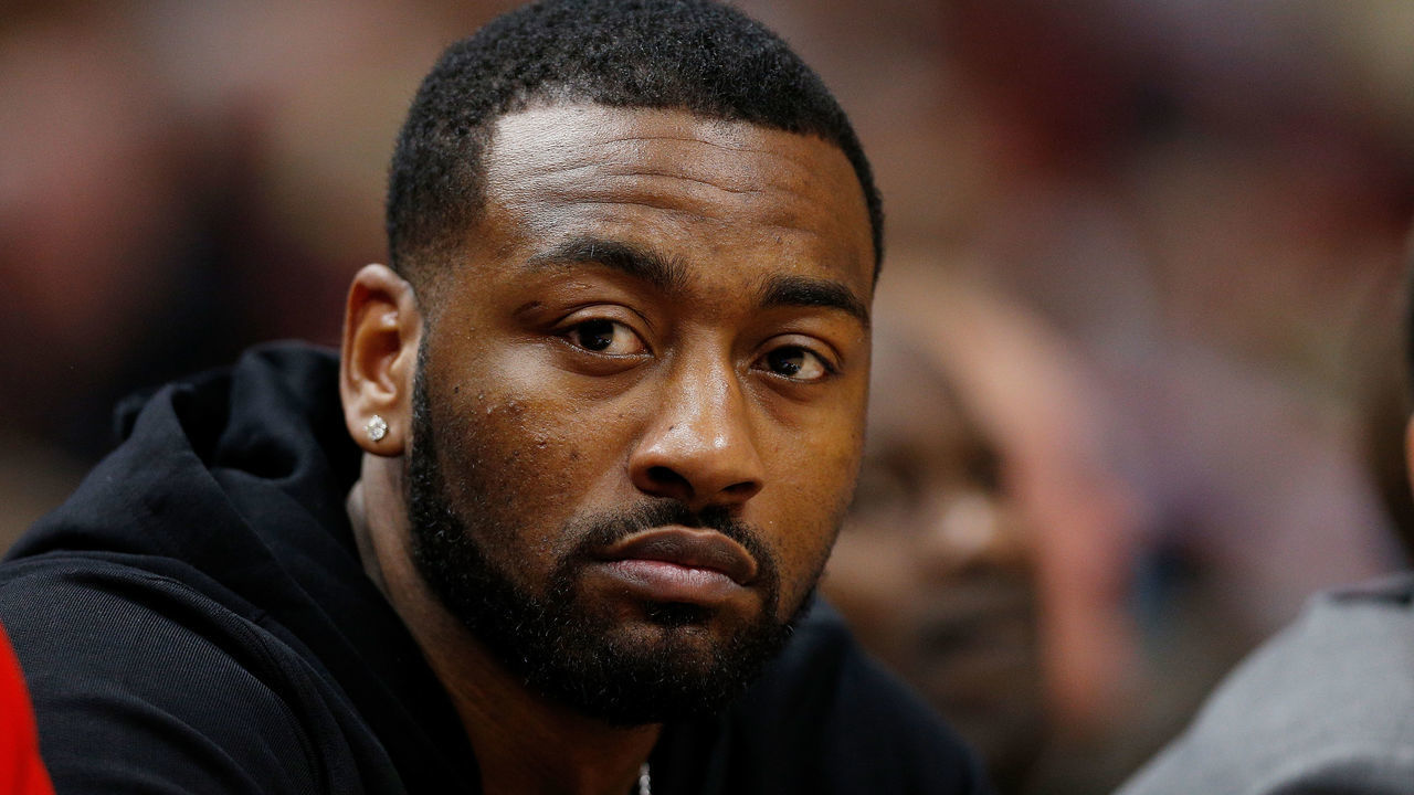 MIAMI, FL - JANUARY 04: John Wall #2 of the Washington Wizards looks on from the bench against the Miami Heat at American Airlines Arena on January 4, 2019 in Miami, Florida.