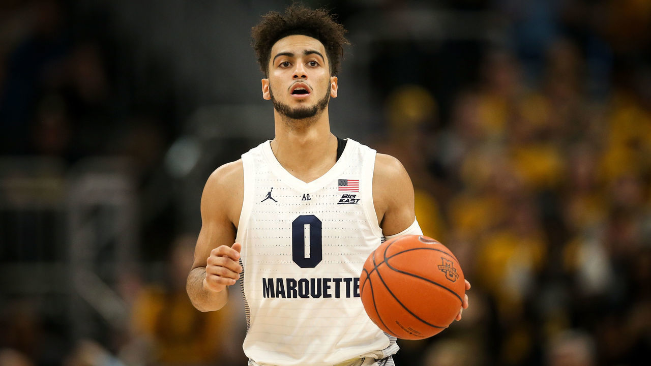 MILWAUKEE, WISCONSIN - DECEMBER 08: Markus Howard #0 of the Marquette Golden Eagles dribbles the ball in the first half against the Wisconsin Badgers at the Fiserv Forum on December 08, 2018 in Milwaukee, Wisconsin.
