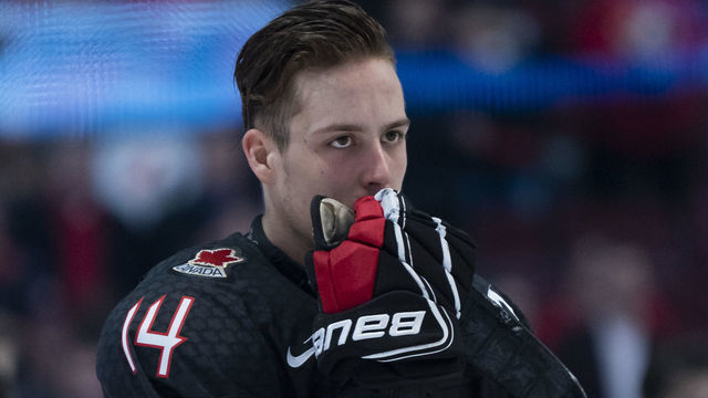VANCOUVER, BC - JANUARY 2: Maxime Comtois #14 of Canada stands dejectedly while listening to the national anthem of Finland after losing 2-1 in Quarterfinal hockey action of the 2019 IIHF World Junior Championship on January, 2, 2019 at Rogers Arena in Vancouver, British Columbia, Canada.