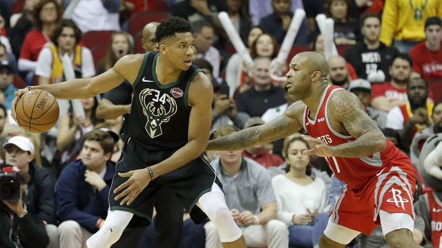 HOUSTON, TX - JANUARY 09: Giannis Antetokounmpo #34 of the Milwaukee Bucks controls the ball defended by PJ Tucker #17 of the Houston Rockets in the second half at Toyota Center on January 9, 2019 in Houston, Texas.