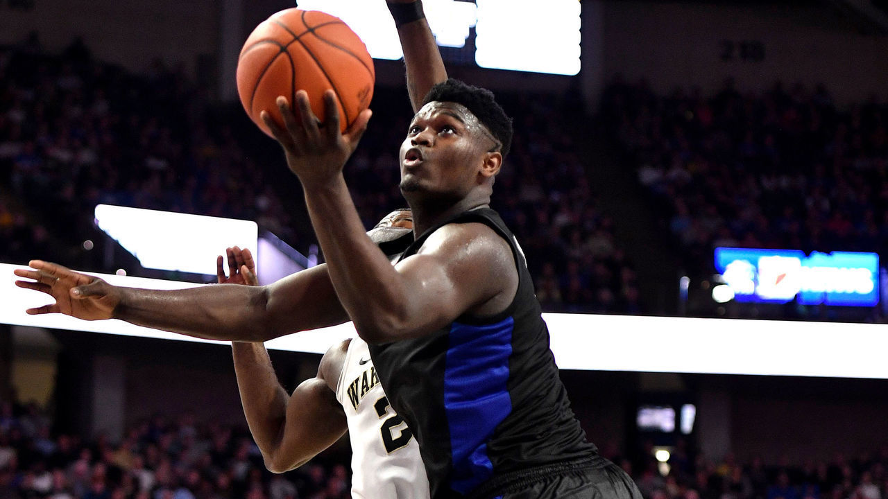 WINSTON-SALEM, NC - JANUARY 08: Zion Williamson #1 of the Duke Blue Devils puts up a shot against Chaundee Brown #23 of the Wake Forest Demon Deacons in the second half at LJVM Coliseum Complex on January 8, 2019 in Winston-Salem, North Carolina. Duke won 87-65.