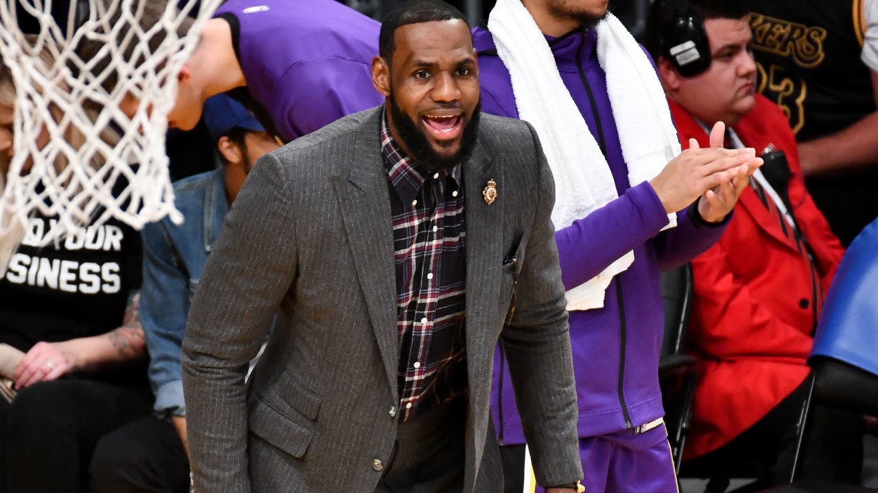 LOS ANGELES, CALIFORNIA - JANUARY 09: Injured LeBron James cheers on his teammates during a basketball game between the Los Angeles Lakers and the Detroit Pistons at Staples Center on January 09, 2019 in Los Angeles, California.