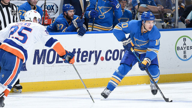 ST. LOUIS, MO - JANUARY 5: Devon Toews #25 of the New York Islanders defends against Brayden Schenn #10 of the St. Louis Blues at Enterprise Center on January 5, 2019 in St. Louis, Missouri.
