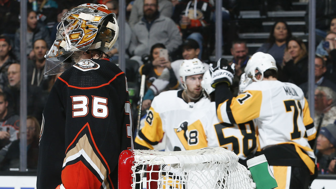 ANAHEIM, CA - JANUARY 11: Goaltender John Gibson #36 of the Anaheim Ducks reacts as the Pittsburgh Penguins celebrate a second-period goal by Evgeni Malkin during the game at Honda Center on January 11, 2019 in Anaheim, California.