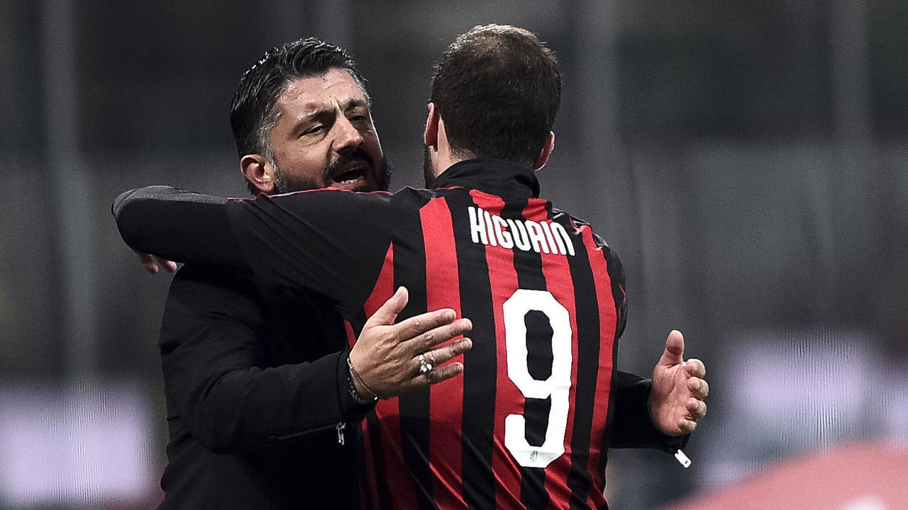 STADIO GIUSEPPE MEAZZA, MILAN, ITALY - 2018/12/29: Gonzalo Higuain (R) of AC Milan celebrates with Gennaro Gattuso, head coach of AC Milan, after scoring a goal during the Serie A football match between AC Milan and SPAL. AC Milan won 2-1 over SPAL.