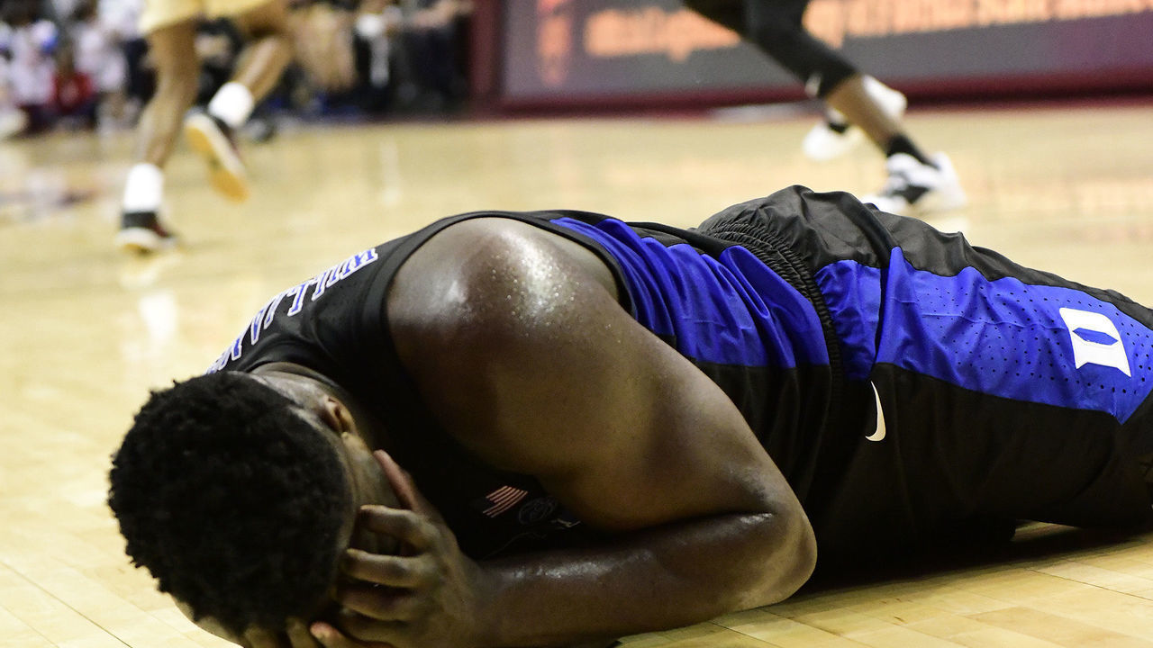TALLAHASSEE, FL - JANUARY 12: Zion Williamson (1) forward Duke University Blue Devils writhes on the floor after a poke in the eye as play continues in an Atlantic Coast Conference (ACC) match-up with Florida State (FSU) Seminoles, Saturday, January 12, 2019, at Donald Tucker Center in Tallahassee, Florida.