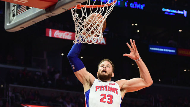 LOS ANGELES, CA - JANUARY 12: Blake Griffin #23 of the Detroit Pistons gets past Shai Gilgeous-Alexander #2 of the Los Angeles Clippers for a dunk in the second half of the game at Staples Center on January 12, 2019 in Los Angeles, California.