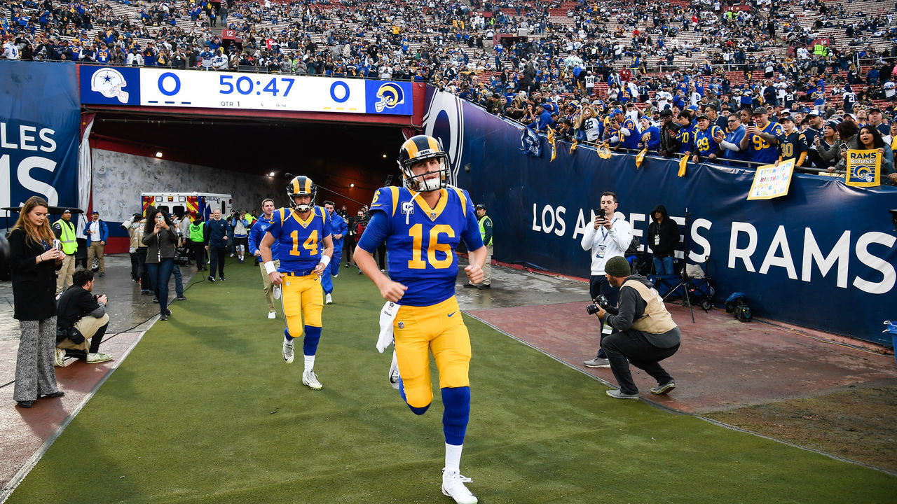 LOS ANGELES, CA - JANUARY 12: Quarterback Jared Goff #16 of the Los Angeles Rams runs out onto the field for warmups ahead of the NFC Divisional Round playoff game against the Dallas Cowboys at Los Angeles Memorial Coliseum on January 12, 2019 in Los Angeles, California.