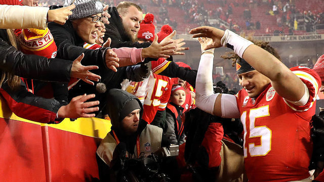 KANSAS CITY, MISSOURI - JANUARY 12: Patrick Mahomes #15 of the Kansas City Chiefs celebrates with fans after the Chiefs defeated the the Indianapolis Colts to win the AFC Divisional round playoff game at Arrowhead Stadium on January 12, 2019 in Kansas City, Missouri.