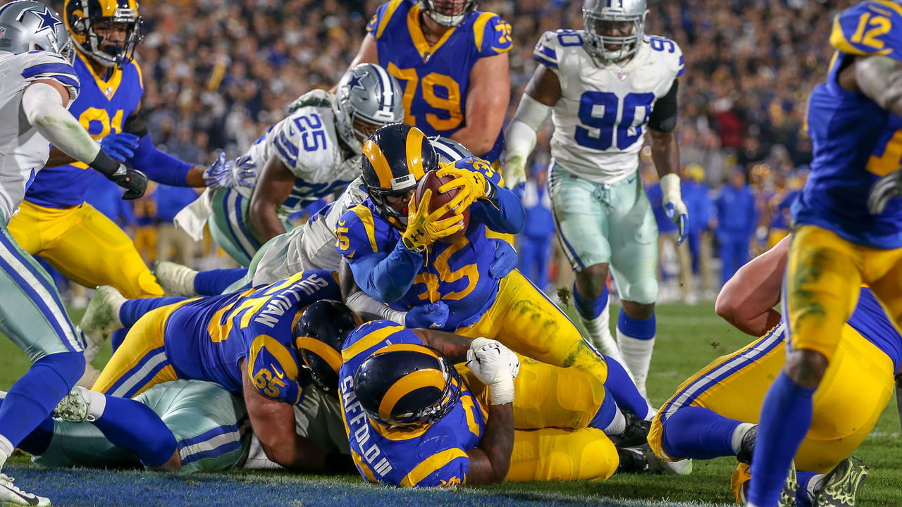 LOS ANGELES, CA - JANUARY 12: Los Angeles Rams running back C. J. Anderson runs for a touchdown the ball during the NFC Divisional Football game between the Dallas Cowboys and the Los Angeles Rams on January 12, 2019 at the Los Angeles Memorial Coliseum in Los Angeles, CA.