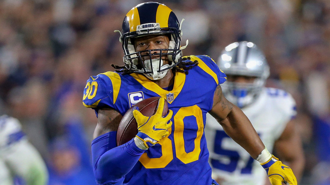 LOS ANGELES, CA - JANUARY 12: Los Angeles Rams running back Todd Gurley (30) runs for a touchdown during the NFC Divisional Football game between the Dallas Cowboys and the Los Angeles Rams on January 12, 2019 at the Los Angeles Memorial Coliseum in Los Angeles, CA.